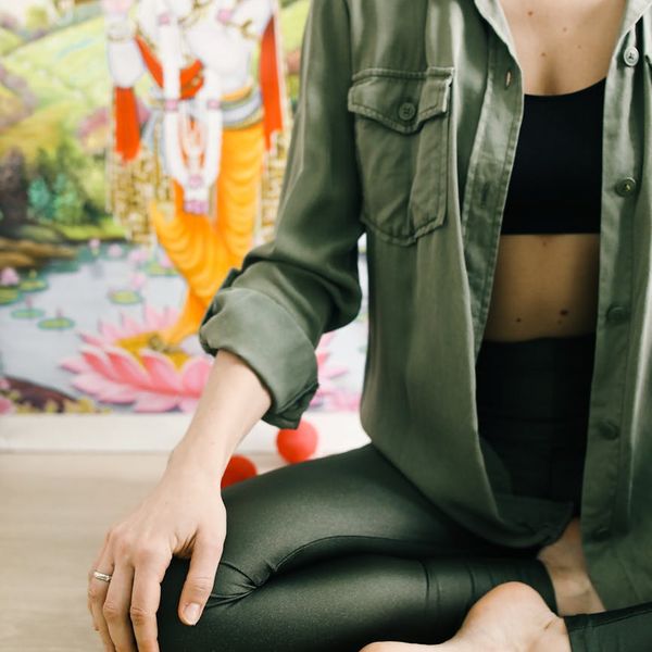 Close up of a person meditating after a cardio session.